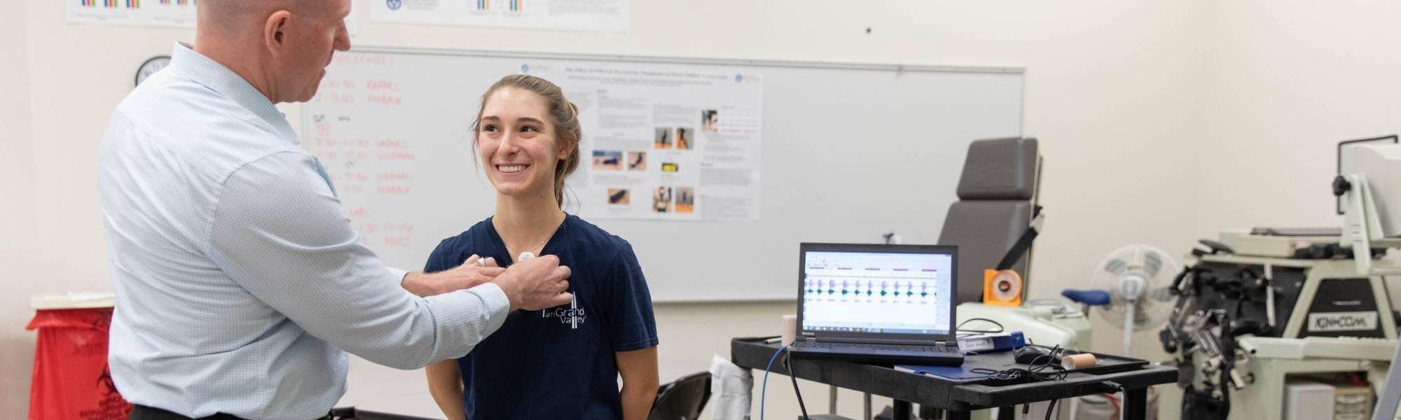 Faculty member working with student in a lab